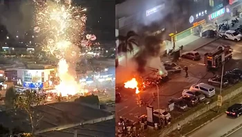 צפו: דוכן זיקוקי דינור עלה בלהבות במלזיה וכמעט גרם לאסון 